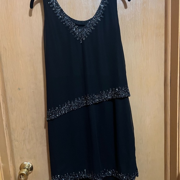 Elegant Black Sleeveless Dress with Embellished Neckline - Picture 5 of 5